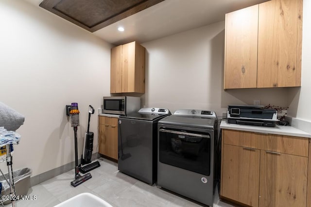 laundry area with separate washer and dryer