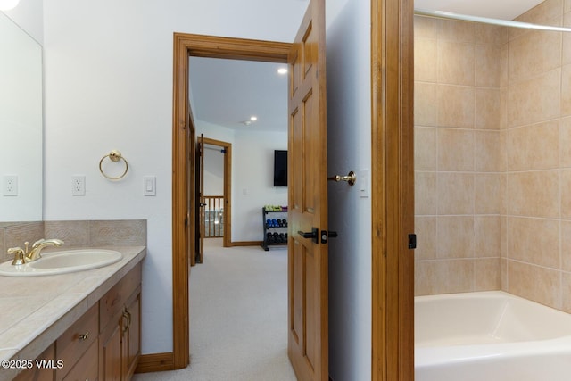220 Singletree Rd, Edwards, CO 81632 - full bath with vanity, baseboards, and washtub / shower combination
