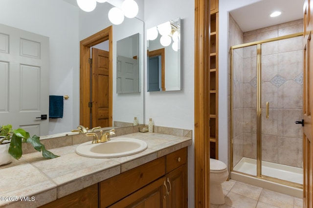 220 Singletree Rd, Edwards, CO 81632 - bathroom with toilet, a stall shower, vanity, and tile patterned flooring