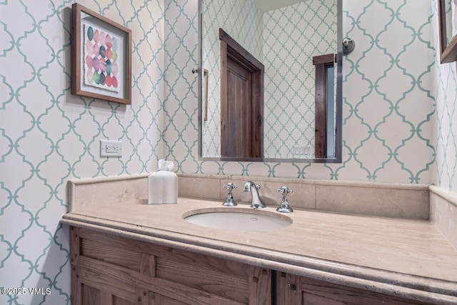 44 Conestoga Cir, Edwards, CO 81632 - bathroom with wallpapered walls and vanity