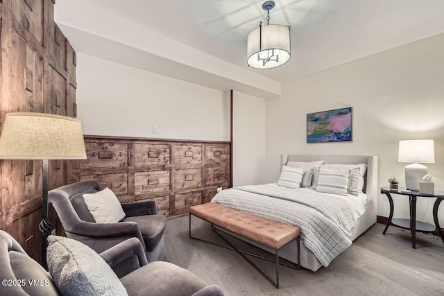 44 Conestoga Cir, Edwards, CO 81632 - bedroom featuring wood finished floors and wooden walls