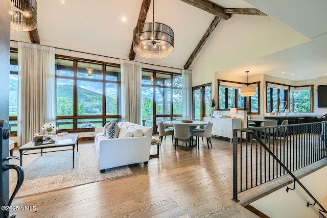 44 Conestoga Cir, Edwards, CO 81632 - living room with high vaulted ceiling, wood finished floors, and beam ceiling