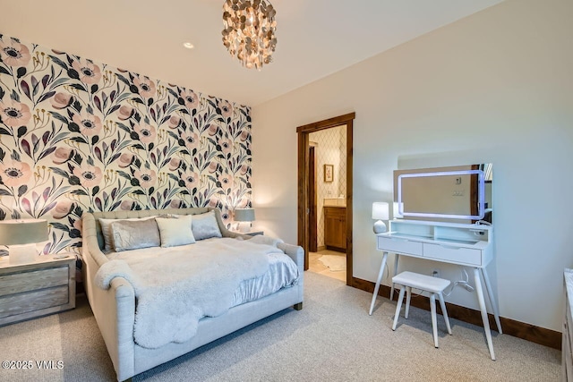 44 Conestoga Cir, Edwards, CO 81632 - carpeted bedroom with baseboards and connected bathroom