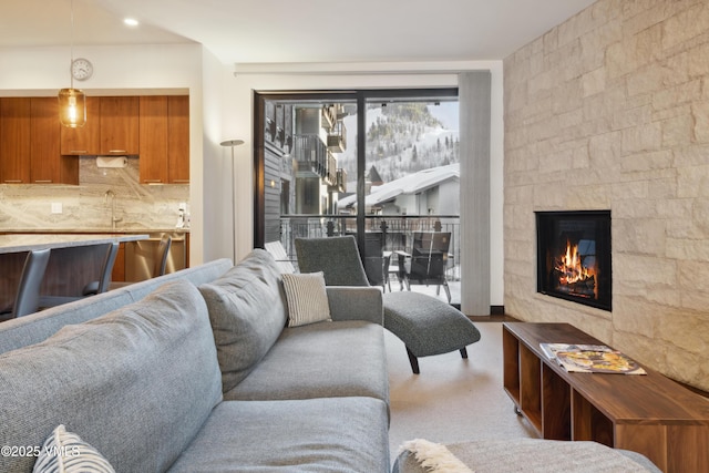 living room with a glass covered fireplace