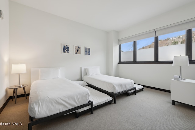 carpeted bedroom with baseboards