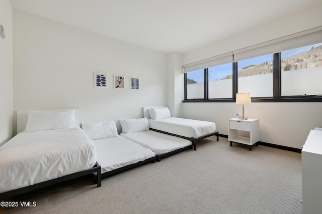 carpeted bedroom with baseboards