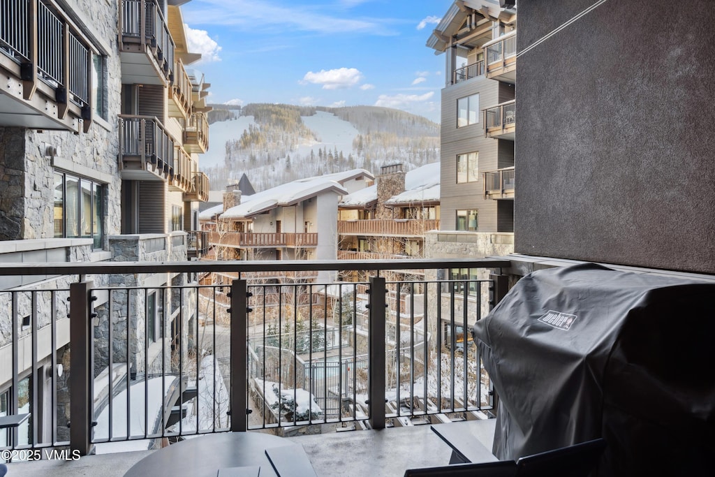 701 W Lionshead Cir Unit E307, Vail, CO 81657 - snow covered back of property featuring a mountain view, a residential view, and grilling area