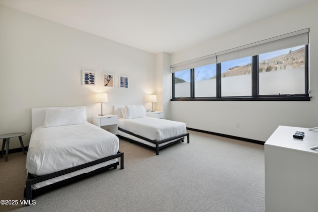 carpeted bedroom with baseboards