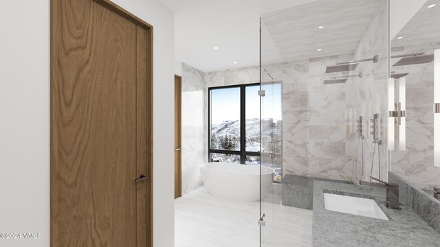 bathroom featuring vanity, a mountain view, and shower with separate bathtub