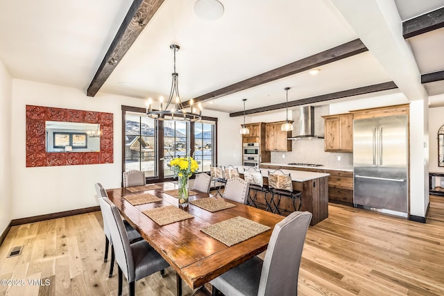 481 Hunters View Ln, Eagle, CO 81631 - dining area with an inviting chandelier, light hardwood / wood-style floors, and beamed ceiling