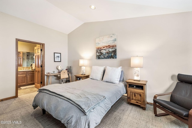 107 Lions Ln, Minturn, CO 81645 - bedroom with light carpet, ensuite bathroom, baseboards, and vaulted ceiling