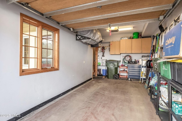 107 Lions Ln, Minturn, CO 81645 - garage with baseboards and a garage door opener