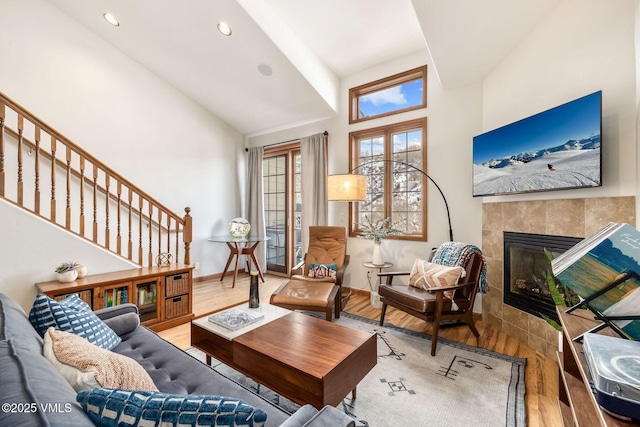 107 Lions Ln, Minturn, CO 81645 - living room featuring baseboards, stairs, wood finished floors, and a fireplace
