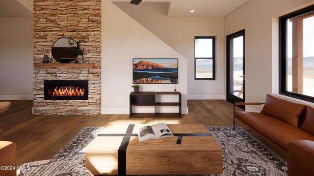 living room with wood-type flooring and a fireplace