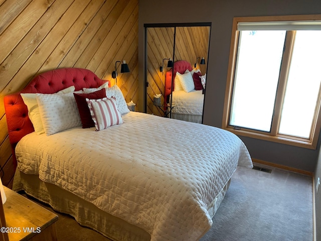 000149 Willis Pl Unit 140, Beaver Creek, CO 81620 - bedroom with baseboards, carpet flooring, and wooden walls