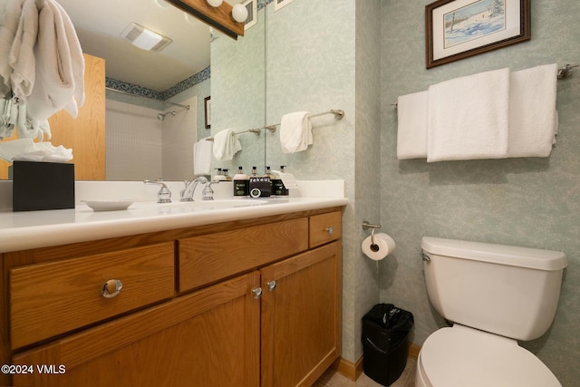 bathroom with vanity and toilet