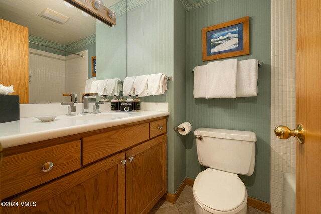 bathroom featuring tile patterned floors, vanity, and toilet