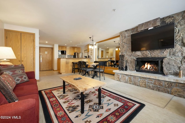 living room featuring a stone fireplace