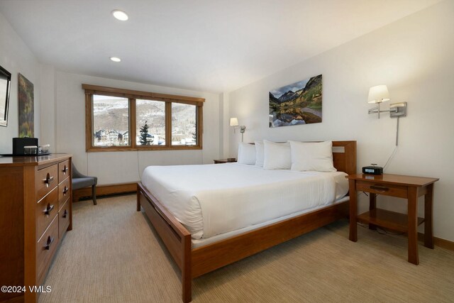 bedroom with light colored carpet