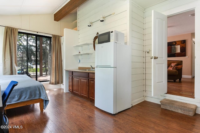 bedroom with lofted ceiling with beams, sink, dark hardwood / wood-style flooring, white refrigerator, and access to outside