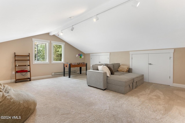 interior space featuring light carpet, a baseboard heating unit, track lighting, and lofted ceiling