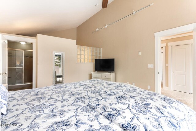 carpeted bedroom featuring vaulted ceiling