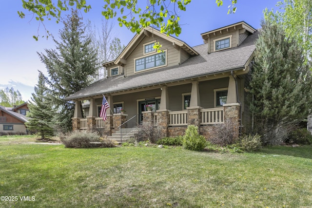 88 E Double Hitch, Eagle, CO 81631 - craftsman-style home with covered porch, a shingled roof, stone siding, and a front yard
