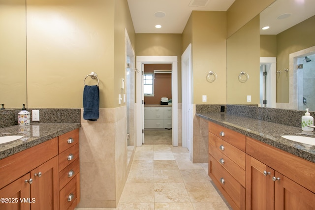88 E Double Hitch, Eagle, CO 81631 - full bath featuring tile walls, a stall shower, two vanities, a wainscoted wall, and tile patterned flooring