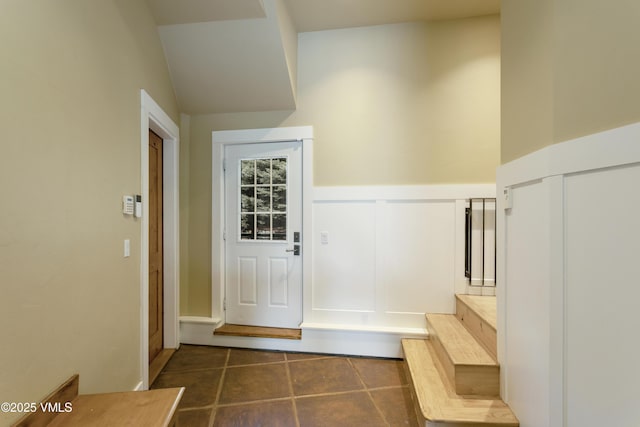 88 E Double Hitch, Eagle, CO 81631 - mudroom featuring dark tile patterned floors, a decorative wall, and wainscoting