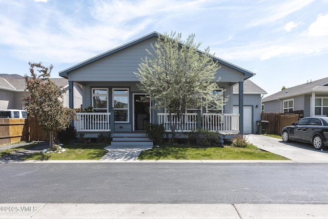 44 Salmon Loop, Gypsum, CO 81637 - view of front of house featuring covered porch, driveway, and a garage