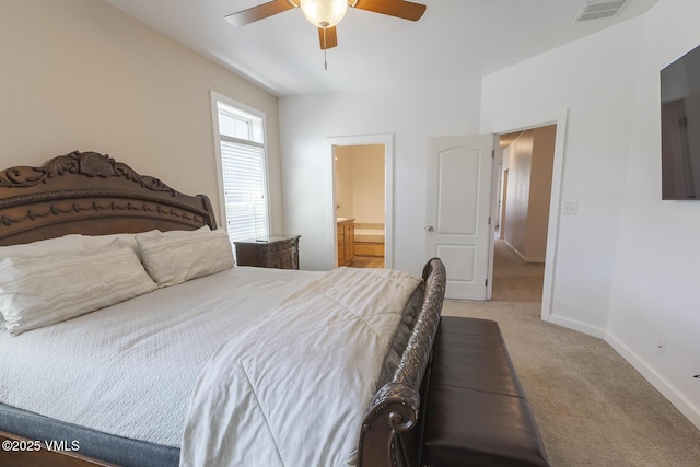 44 Salmon Loop, Gypsum, CO 81637 - bedroom featuring light colored carpet, baseboards, ceiling fan, and ensuite bathroom