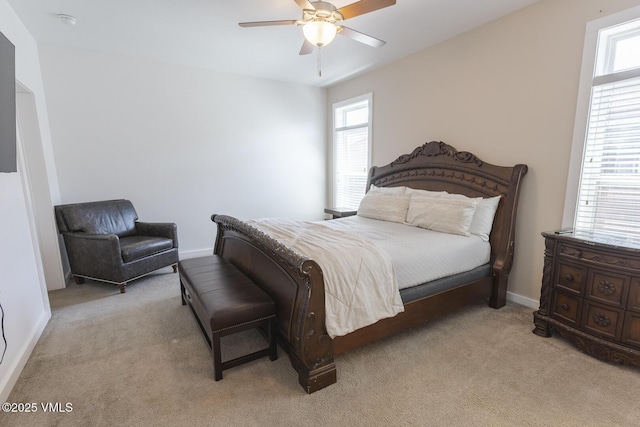 44 Salmon Loop, Gypsum, CO 81637 - bedroom featuring multiple windows, light colored carpet, a ceiling fan, and baseboards