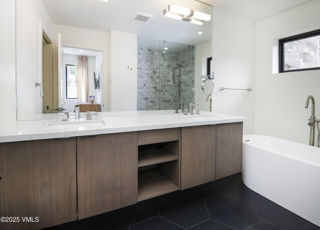 1133 Main St, Minturn, CO 81645 - full bathroom featuring double vanity, a sink, a freestanding tub, and tiled shower
