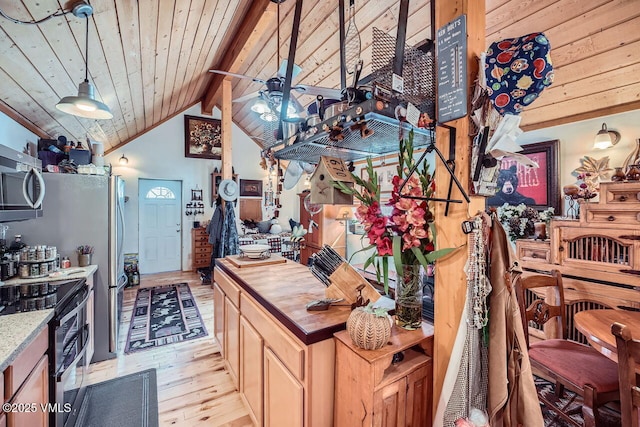 425 Howard St, Eagle, CO 81631 - kitchen with stainless steel appliances, light wood-style floors, butcher block counters, a ceiling fan, and wooden ceiling