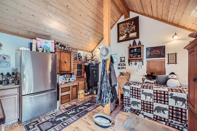 425 Howard St, Eagle, CO 81631 - kitchen with freestanding refrigerator, wood ceiling, light wood-style floors, light countertops, and brown cabinets