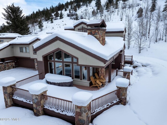 view of snow covered house