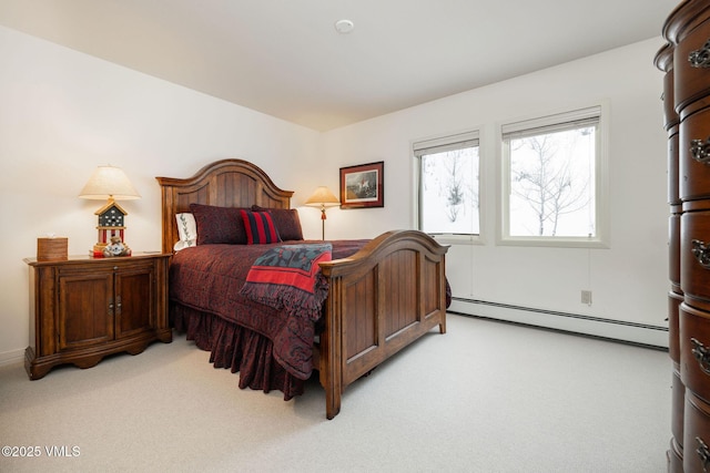 carpeted bedroom featuring a baseboard heating unit