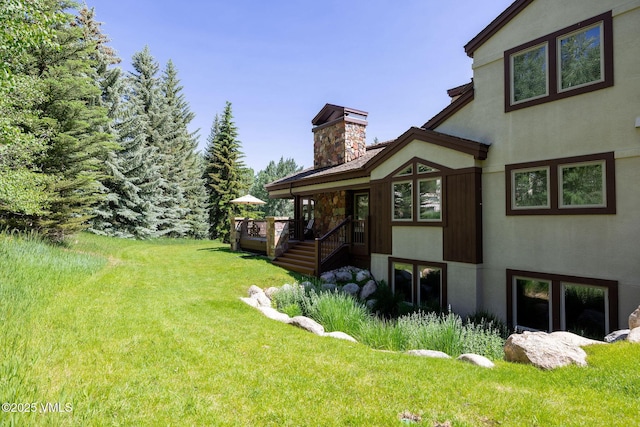 51 Hillside Ct W, Edwards, CO 81632 - view of grassy yard featuring a deck