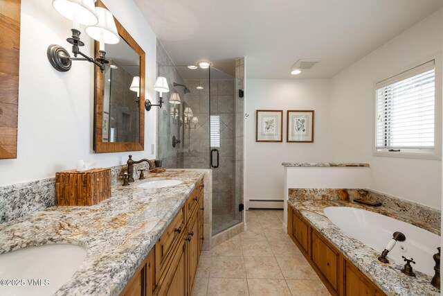 bathroom with tile patterned flooring, shower with separate bathtub, a baseboard heating unit, and vanity