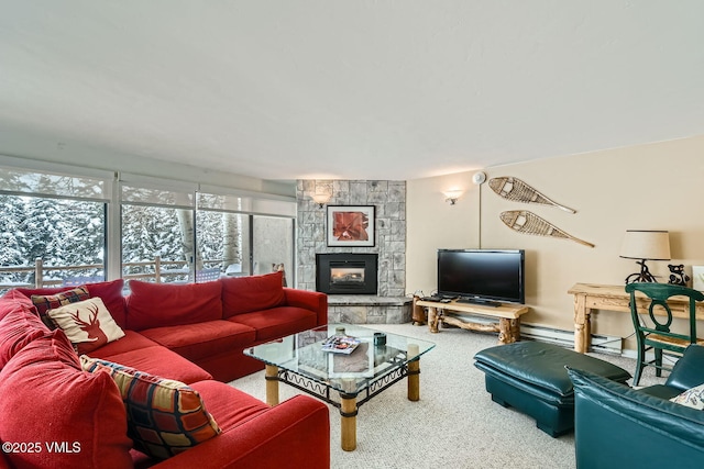 living room featuring carpet flooring and a stone fireplace