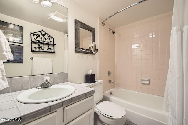 bathroom featuring toilet, shower / bath combo, and vanity