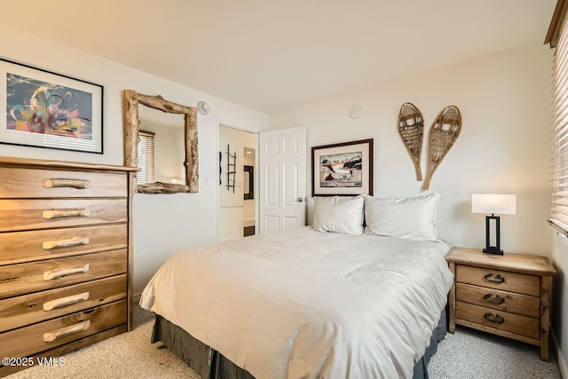 bedroom featuring light colored carpet