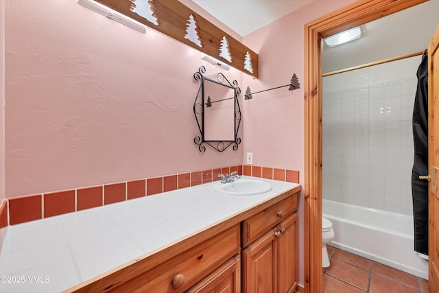 full bathroom with vanity, toilet, tile patterned flooring, and shower / bath combo with shower curtain