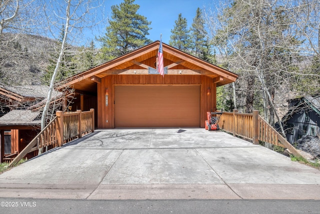 garage with concrete driveway