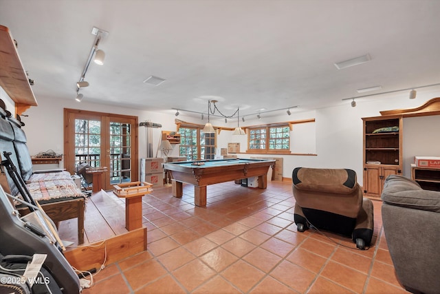 game room featuring french doors, rail lighting, billiards, and light tile patterned floors