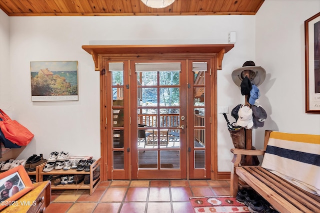 doorway with french doors and wood ceiling