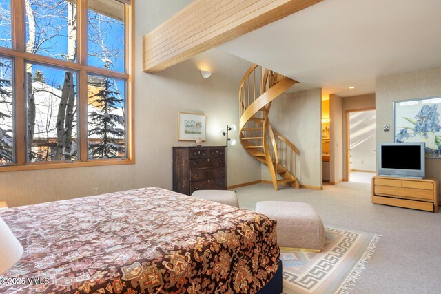 carpeted bedroom featuring multiple windows