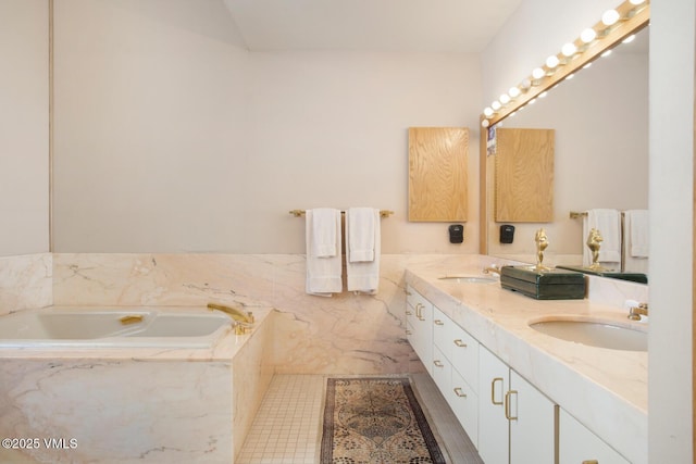 bathroom featuring vanity and tiled bath