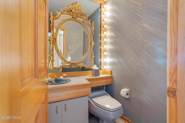 bathroom with vanity and toilet