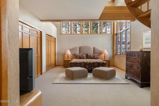 sitting room featuring plenty of natural light and light colored carpet